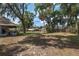 Spacious backyard with lush greenery, mature trees, providing a serene and private outdoor space at 3823 Se 49Th St, Ocala, FL 34480