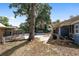Beautiful backyard featuring a pool, cabana, patio with seating, and mature trees at 3823 Se 49Th St, Ocala, FL 34480