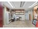 Unfinished basement area with open storage, shelves, and concrete flooring at 3823 Se 49Th St, Ocala, FL 34480