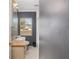 Functional bathroom with wood countertop vanity and neutral walls and large window at 3823 Se 49Th St, Ocala, FL 34480