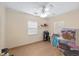 Bright bedroom with wood-look flooring, neutral walls, and ample natural light at 3823 Se 49Th St, Ocala, FL 34480