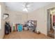 Bright bedroom featuring a window, ceiling fan, and laminate wood flooring at 3823 Se 49Th St, Ocala, FL 34480