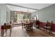 Bright dining room with a vintage chandelier and a large window at 3823 Se 49Th St, Ocala, FL 34480