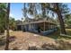 Charming home exterior with covered porch and well-maintained lawn, offering a welcoming curb appeal at 3823 Se 49Th St, Ocala, FL 34480