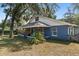 Exterior view of a charming home with a covered porch and lush landscaping, providing a warm and inviting atmosphere at 3823 Se 49Th St, Ocala, FL 34480