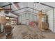 Spacious metal garage with large sliding door, suitable for parking, storage, or use as a workshop for hobbies at 3823 Se 49Th St, Ocala, FL 34480