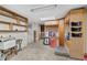 Spacious garage features built-in shelving, storage cabinets, and ample room for various projects and storage needs at 3823 Se 49Th St, Ocala, FL 34480