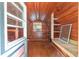 Unique interior featuring wood paneling, built-in shelving, and natural light from the window at 3823 Se 49Th St, Ocala, FL 34480