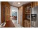 Charming kitchen with custom wood cabinets and stainless steel refrigerator at 3823 Se 49Th St, Ocala, FL 34480