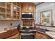 Charming kitchen featuring custom wood cabinets, modern stainless steel appliances, and unique countertops at 3823 Se 49Th St, Ocala, FL 34480
