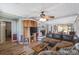 Inviting living room featuring a fireplace, built-in shelves, and comfortable furnishings at 3823 Se 49Th St, Ocala, FL 34480