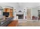 Cozy living room with fireplace, staircase, and built-in bookshelves at 3823 Se 49Th St, Ocala, FL 34480
