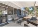 Comfortable covered patio featuring rattan seating and overhead ceiling fan at 3823 Se 49Th St, Ocala, FL 34480