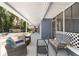 Relaxing covered patio with comfortable seating and a view of the backyard at 3823 Se 49Th St, Ocala, FL 34480
