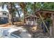 Poolside with a charming wooden cabana, deck area and lush green surroundings at 3823 Se 49Th St, Ocala, FL 34480