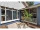 Cozy screened-in porch area with a view of the yard, providing an inviting outdoor space for relaxation at 3823 Se 49Th St, Ocala, FL 34480