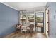 Charming screened-in porch with wicker seating and views of the backyard, perfect for enjoying the outdoors at 3823 Se 49Th St, Ocala, FL 34480