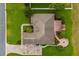 Aerial view of home showing the roof, patio, landscaping, driveway, and surrounding greenery at 4015 Se 22Nd St, Ocala, FL 34471