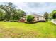 Large backyard with lawn and hot tub at 4015 Se 22Nd St, Ocala, FL 34471
