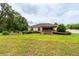Large backyard with lawn and hot tub at 4015 Se 22Nd St, Ocala, FL 34471