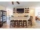 Entertain in style with this home's wet bar and stools, with the living room nearby at 4015 Se 22Nd St, Ocala, FL 34471