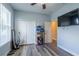 Bright bedroom features a double closet, door, and TV at 4015 Se 22Nd St, Ocala, FL 34471