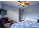 Cozy bedroom with a ceiling fan, tv and large closet at 4015 Se 22Nd St, Ocala, FL 34471