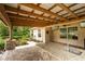 Relaxing covered patio with outdoor kitchen and sink, fan, and brick walkway at 4015 Se 22Nd St, Ocala, FL 34471