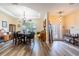 Formal dining room showcasing elegant chandelier and wood floors at 4015 Se 22Nd St, Ocala, FL 34471