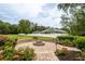 Fire pit surrounded by brick pavers and landscaping at 4015 Se 22Nd St, Ocala, FL 34471