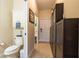 Hallway with built-in cabinets and access to the bathroom and front door at 4015 Se 22Nd St, Ocala, FL 34471