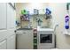 Laundry room with washer, dryer, and ample storage space at 4015 Se 22Nd St, Ocala, FL 34471