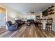 Cozy living room with a ceiling fan, wet bar and comfortable seating at 4015 Se 22Nd St, Ocala, FL 34471