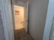 Compact bathroom featuring tiled floor, a toilet, and a small window at 4460 Sw 44Th St, Ocala, FL 34474
