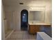 Bathroom featuring a walk-in shower, single sink vanity, and tiled flooring at 4460 Sw 44Th St, Ocala, FL 34474