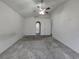 Large bedroom with ceiling fan and arched entryway to the bathroom at 4460 Sw 44Th St, Ocala, FL 34474