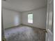 Bright bedroom with carpet flooring, neutral walls, and ample natural light at 4460 Sw 44Th St, Ocala, FL 34474