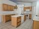 Spacious kitchen featuring an island, plenty of cabinet space, and a full appliance package at 4460 Sw 44Th St, Ocala, FL 34474