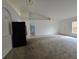 Open concept living room featuring a fridge and view to the front door at 4460 Sw 44Th St, Ocala, FL 34474