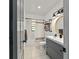 Modern bathroom with vanity, mirror, and shower-tub combo at 4601 Se 18Th Ave, Ocala, FL 34480