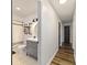 Updated bathroom featuring gray vanity, decorative mirror, and walk-in shower with stylish hardware at 4601 Se 18Th Ave, Ocala, FL 34480