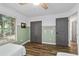 Bright bedroom with wood-look floors and closet at 4601 Se 18Th Ave, Ocala, FL 34480