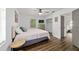 Bedroom featuring wood-look floors, closet, and light-colored walls at 4601 Se 18Th Ave, Ocala, FL 34480