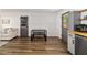 Bright dining area featuring wood-look flooring and a bench-style dining table at 4601 Se 18Th Ave, Ocala, FL 34480