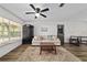 Inviting living room showcases natural light, wood floors, neutral furniture and dining area at 4601 Se 18Th Ave, Ocala, FL 34480