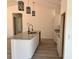 Open kitchen offers granite counters, white cabinets, and attractive pendant lighting at 5701 Nw 6Th Pl, Ocala, FL 34482