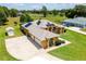 Spacious estate with a three-car garage, in-ground pool, and manicured lawns at 5815 Ne 70Th St, Silver Springs, FL 34488