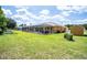 The backyard features a screened pool, an outbuilding, and a cultivated garden at 5815 Ne 70Th St, Silver Springs, FL 34488