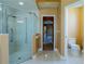 Bright bathroom featuring a glass enclosed shower with decorative tiling and updated fixtures at 5815 Ne 70Th St, Silver Springs, FL 34488
