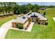 Stunning home featuring a well manicured lawn, solar panels, and elegant landscaping at 5815 Ne 70Th St, Silver Springs, FL 34488